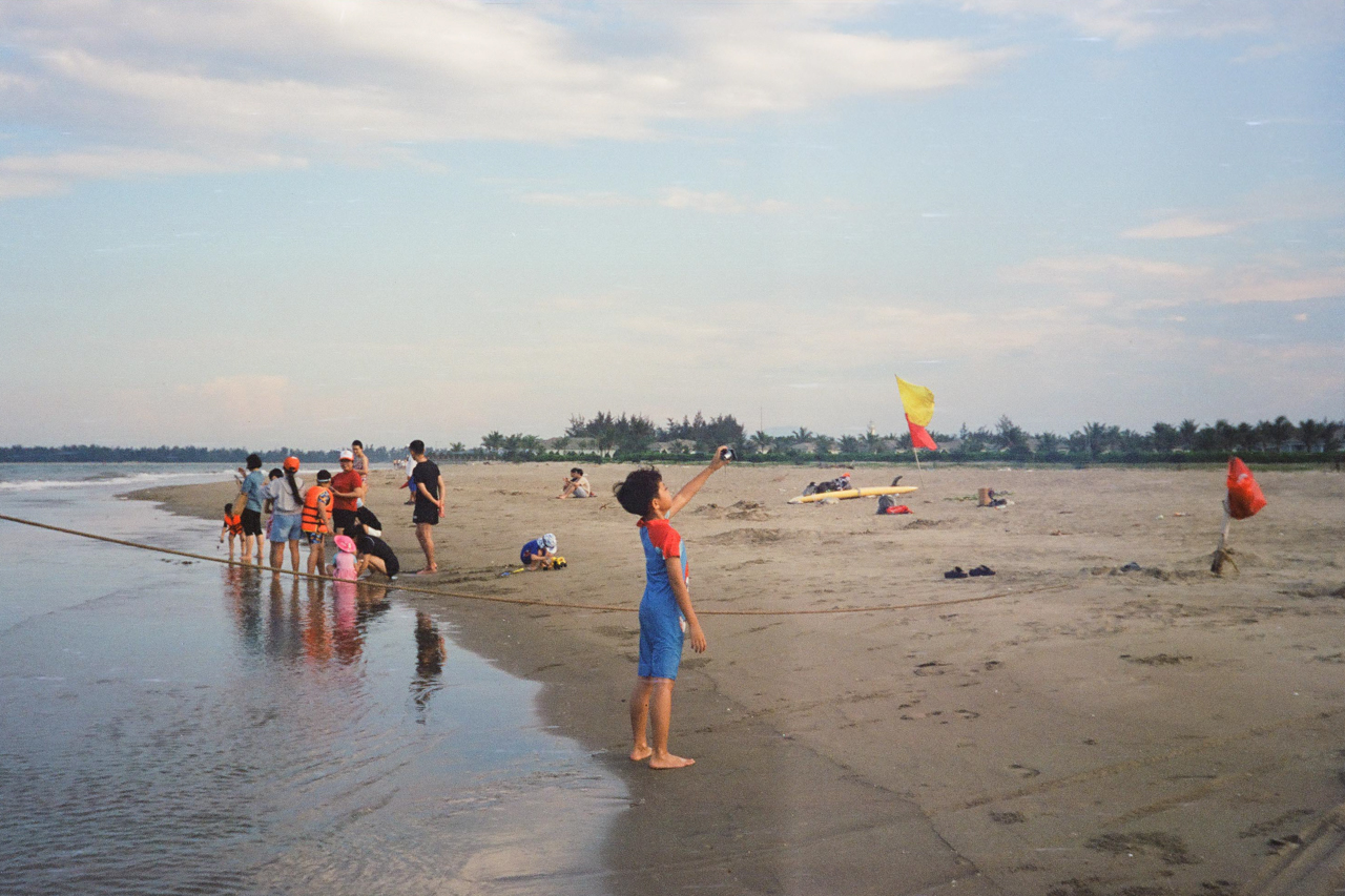 Kid taking a selfie on the beach